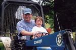 Corky and Cole are having fun on the Bush Hog tractor